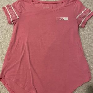 Pink Hollister graphic tee.